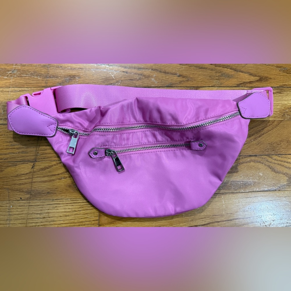 Pink Crossbody Bag with Adjustable Strap and Zippered Compartments